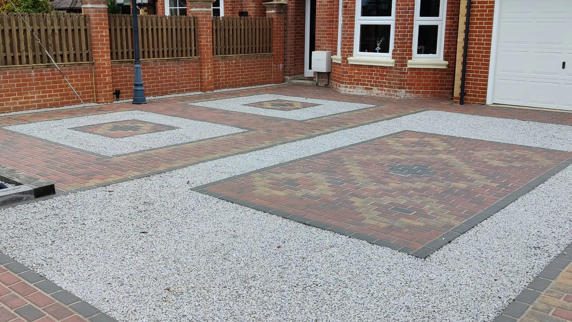 A block paved and gravel driveway laid by Merseyside Driveways